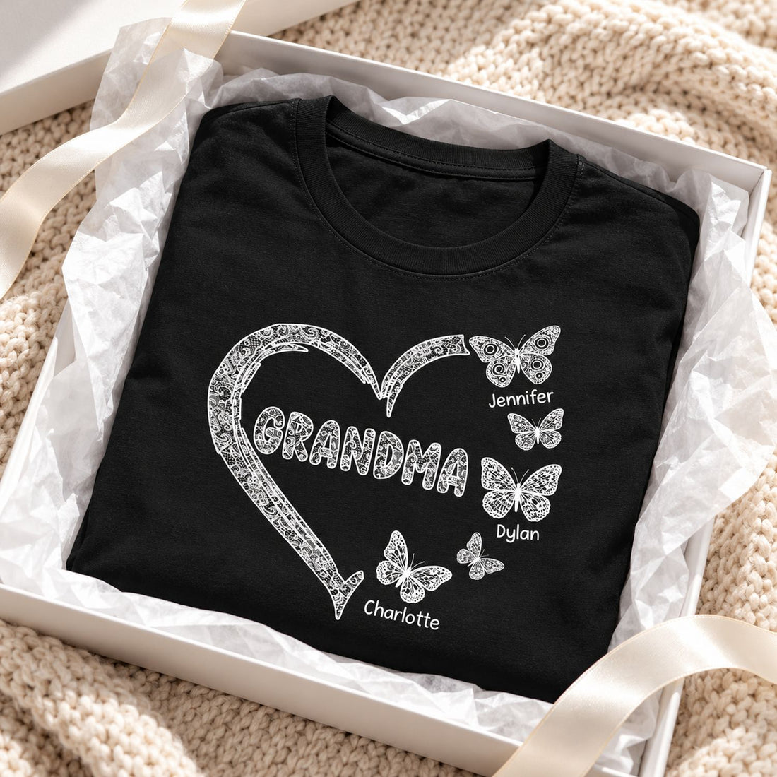 Personalized Grandma butterfly heart t-shirt folded in a holiday gift box with ribbon