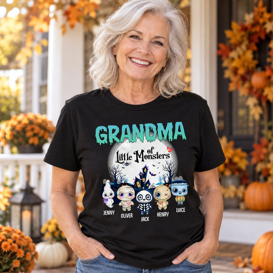 Grandma wearing personalized Grandma Of Little Monsters Halloween t-shirt on autumn porch