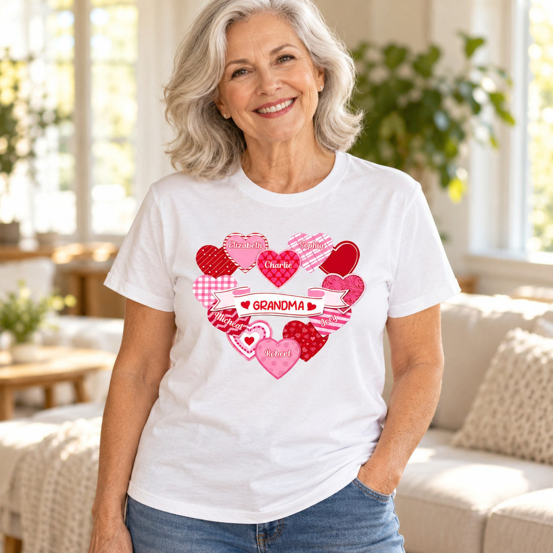 Grandma wearing personalized heart wreath t-shirt with grandchildren names in bright living room