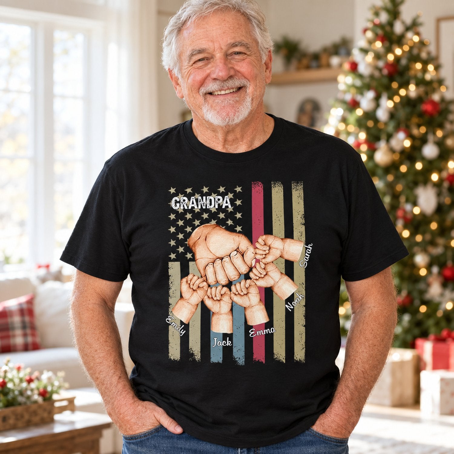 Grandpa wearing personalized Grandpa Fist Bump black t-shirt in a bright holiday living room