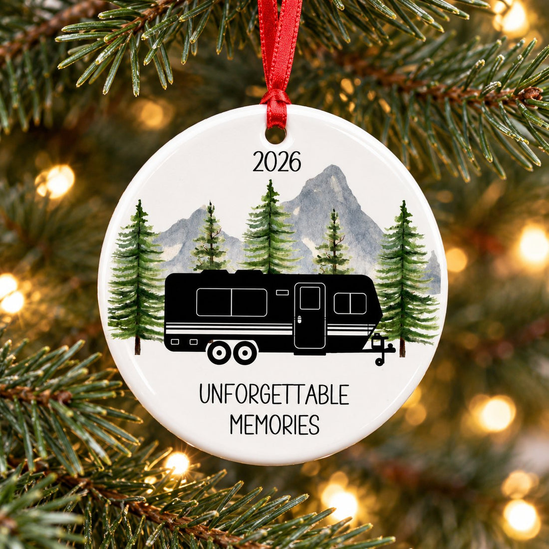 Happy Campers RV personalized circle ceramic ornament hanging on a Christmas tree branch with warm lights