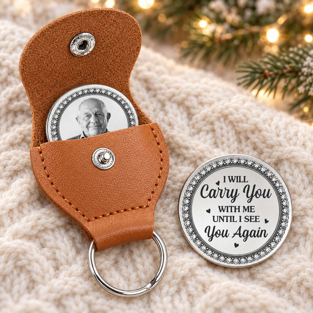 Personalized memorial leather pocket hug keychain and photo coin on cozy holiday knit surface