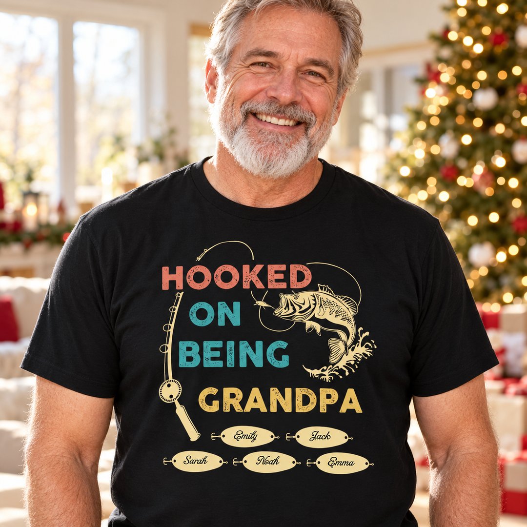 Grandpa wearing personalized Hooked On Being Grandpa fishing t-shirt in bright holiday living room