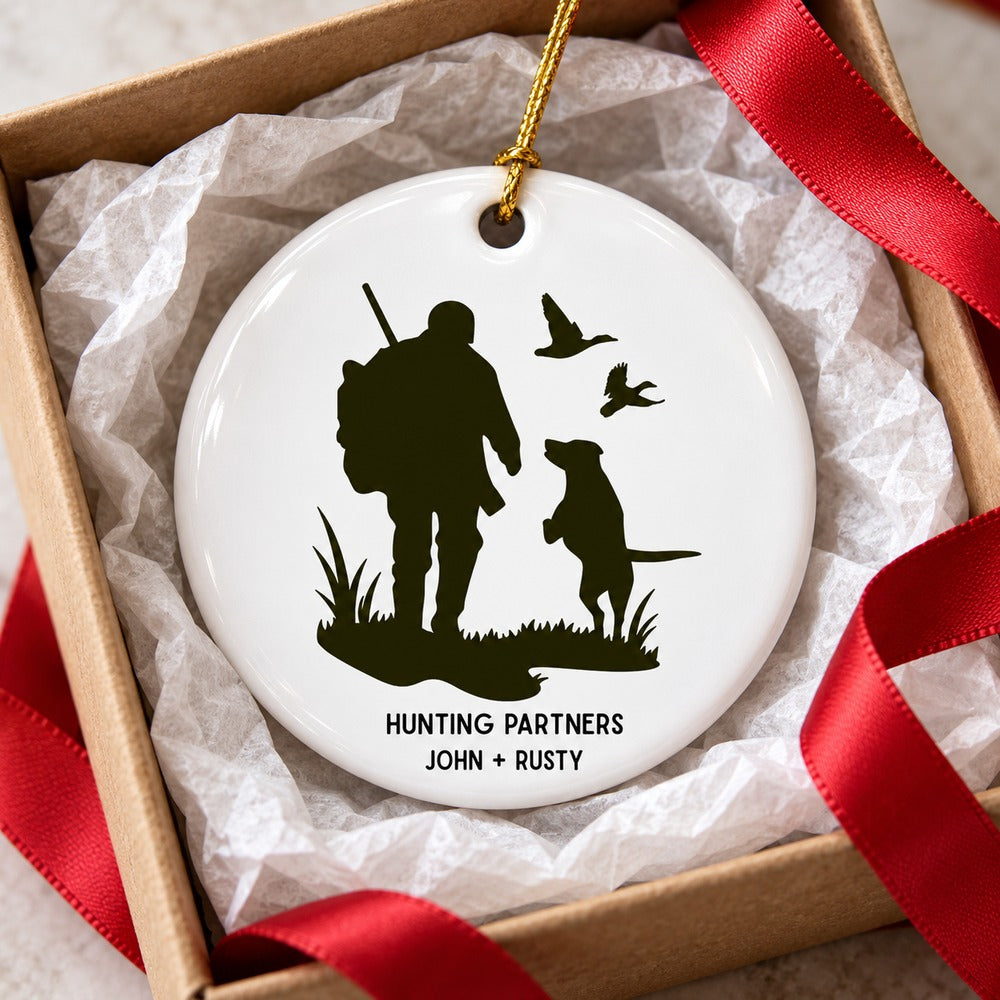 Personalized hunting partners ornament nestled in a small gift box with tissue paper