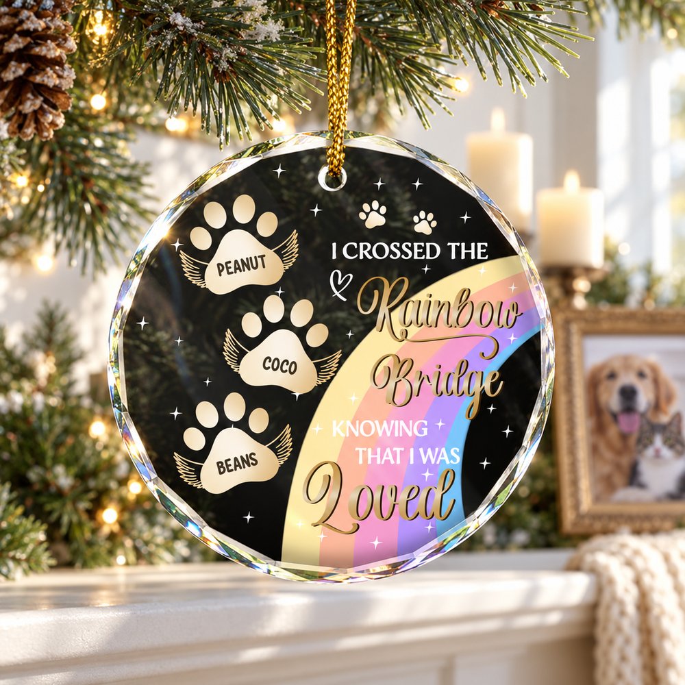 Rainbow Bridge pet memorial circle glass ornament hanging on a bright holiday mantel garland