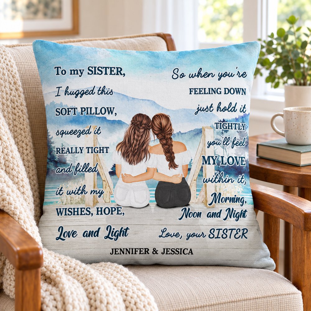 Personalized sister pillow next to a coffee mug and book for size comparison