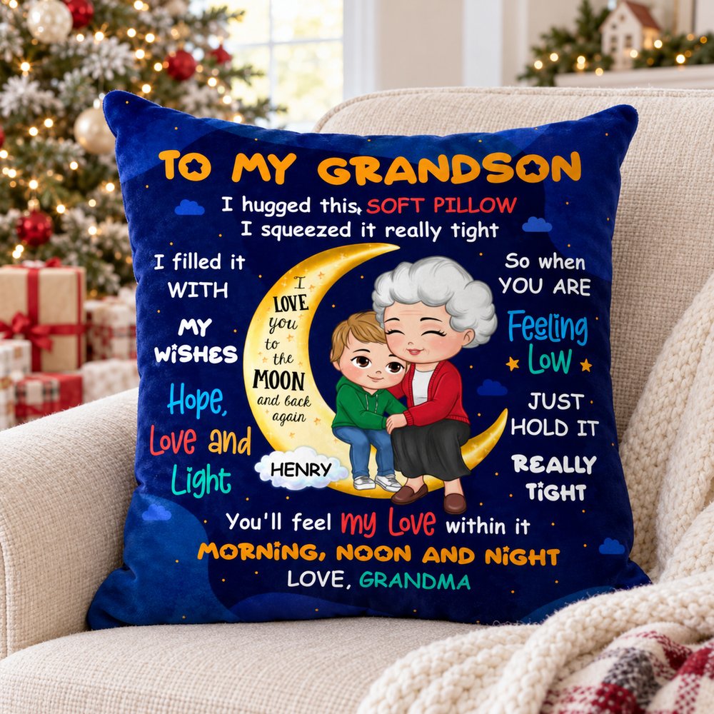 Personalized To My Grandson moon pillow on a cozy armchair near a Christmas tree