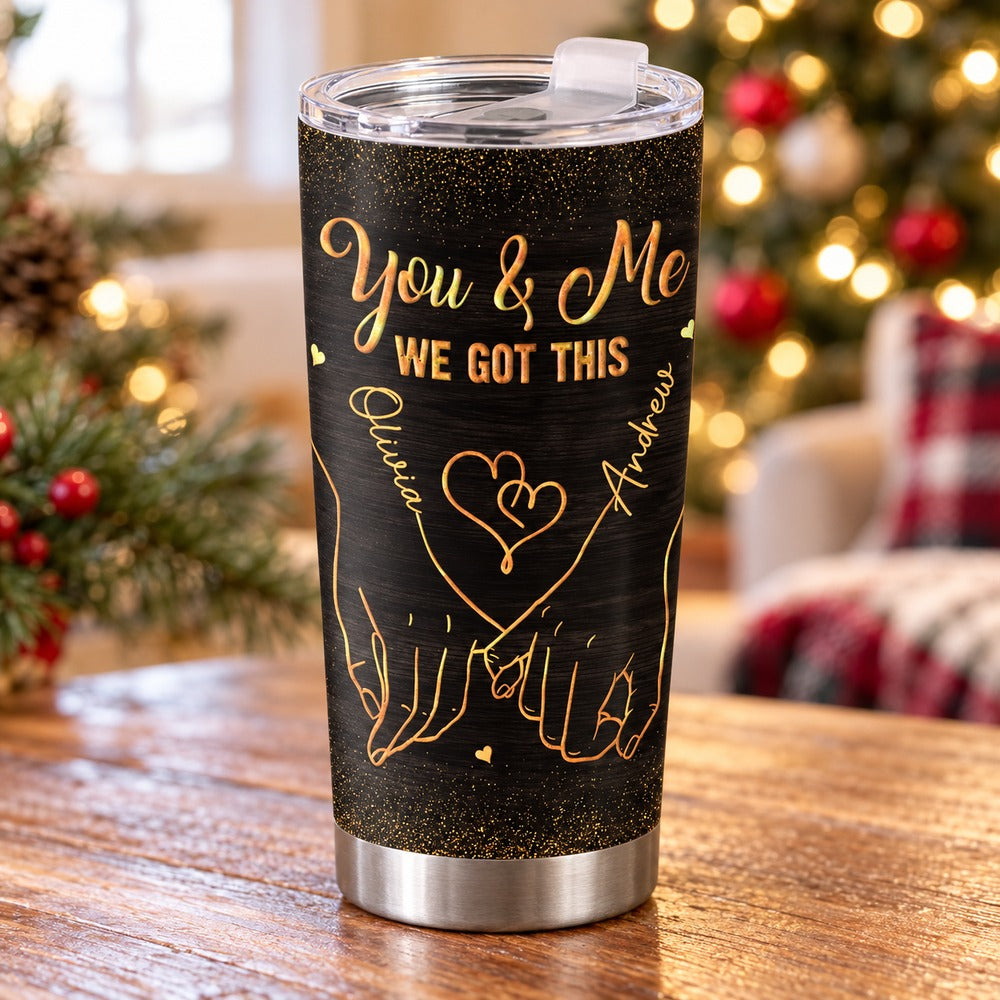 Personalized couple 20oz fat tumbler with You and Me design on table near Christmas lights