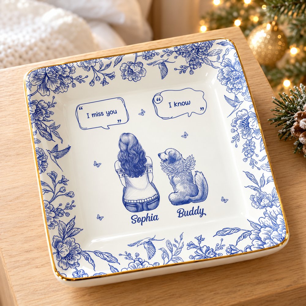Dog memorial personalized jewelry dish on a bedside table with soft Christmas tree lights