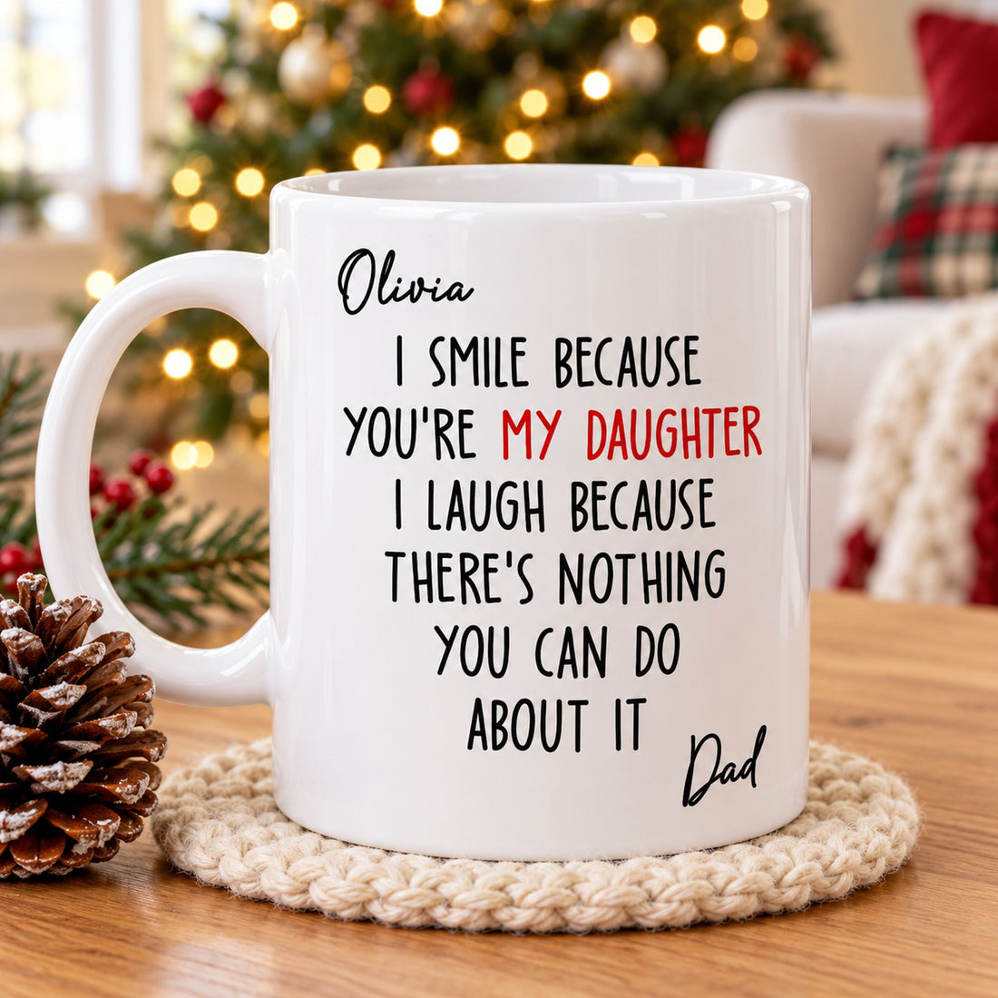 Personalized daughter mug from dad on a wooden table next to a Christmas tree