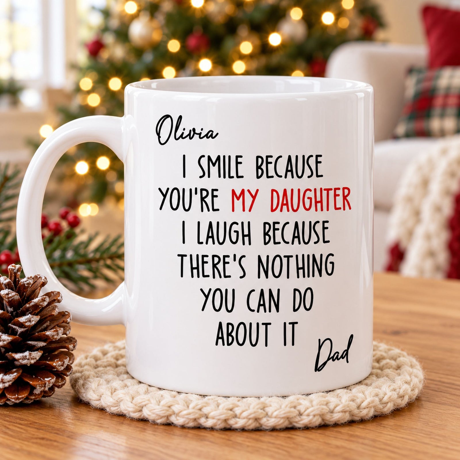Personalized daughter mug from dad on a wooden table next to a Christmas tree