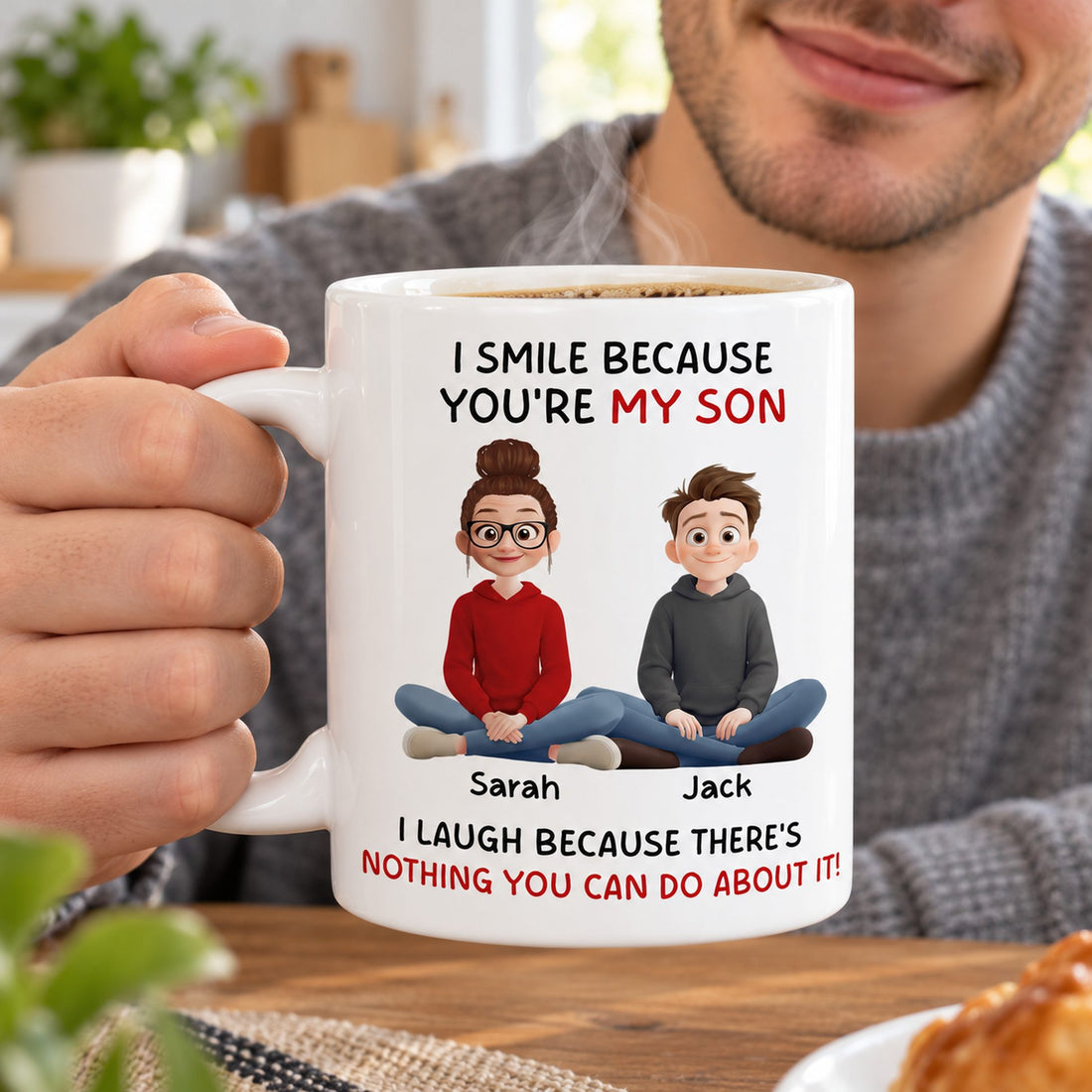 Young man holding personalized I Smile Because You Are My Son coffee mug with rising steam
