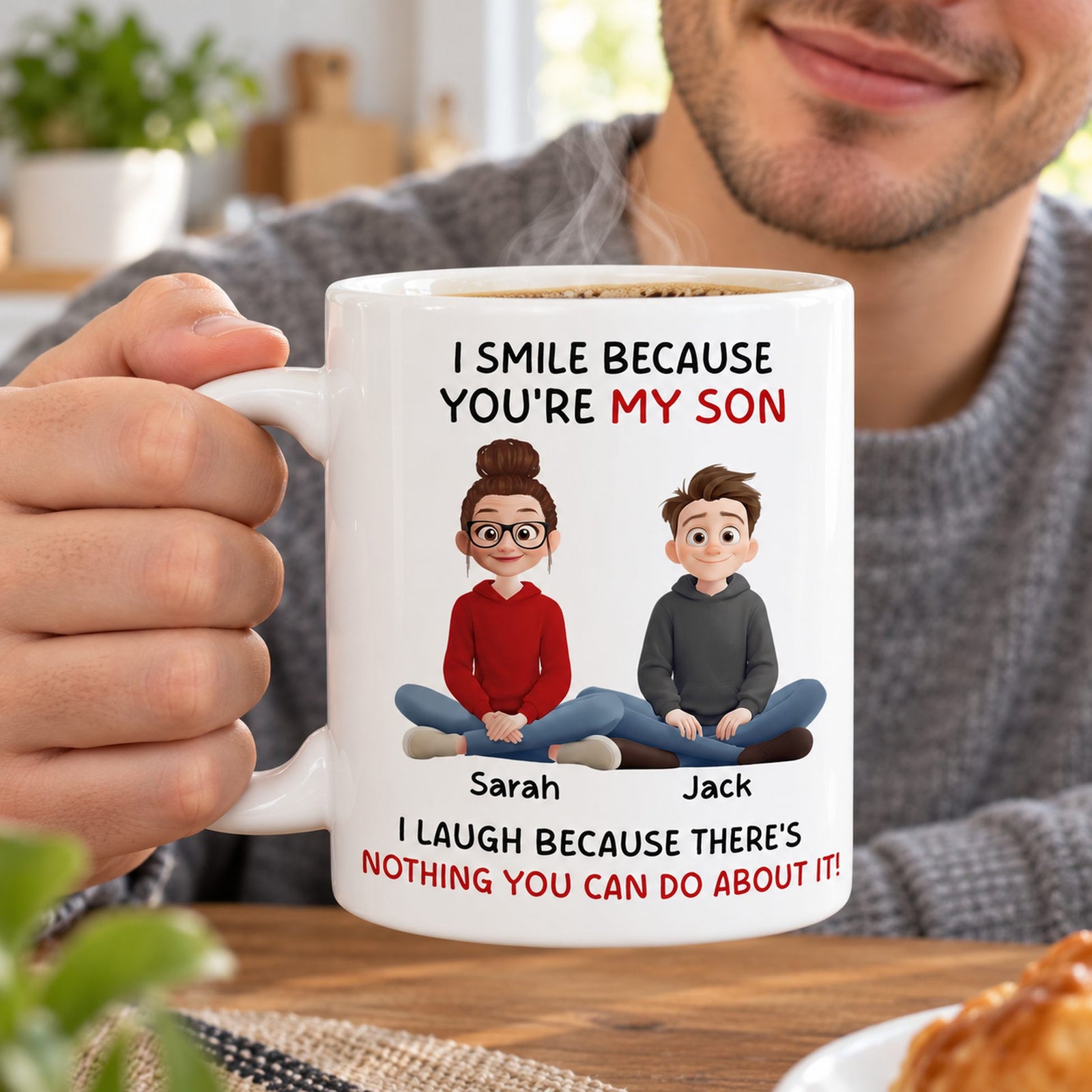 Young man holding personalized I Smile Because You Are My Son coffee mug with rising steam