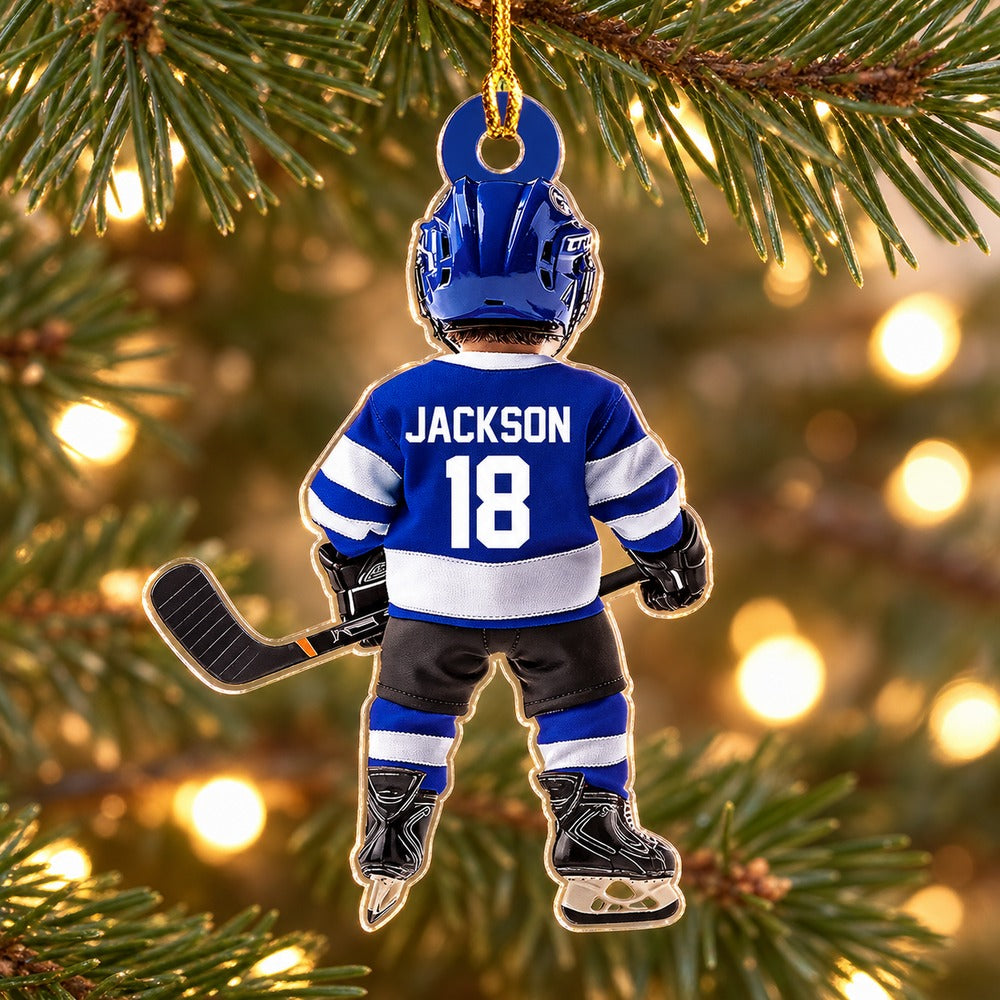 Personalized ice hockey acrylic ornament JACKSON 18 hanging on a Christmas tree branch