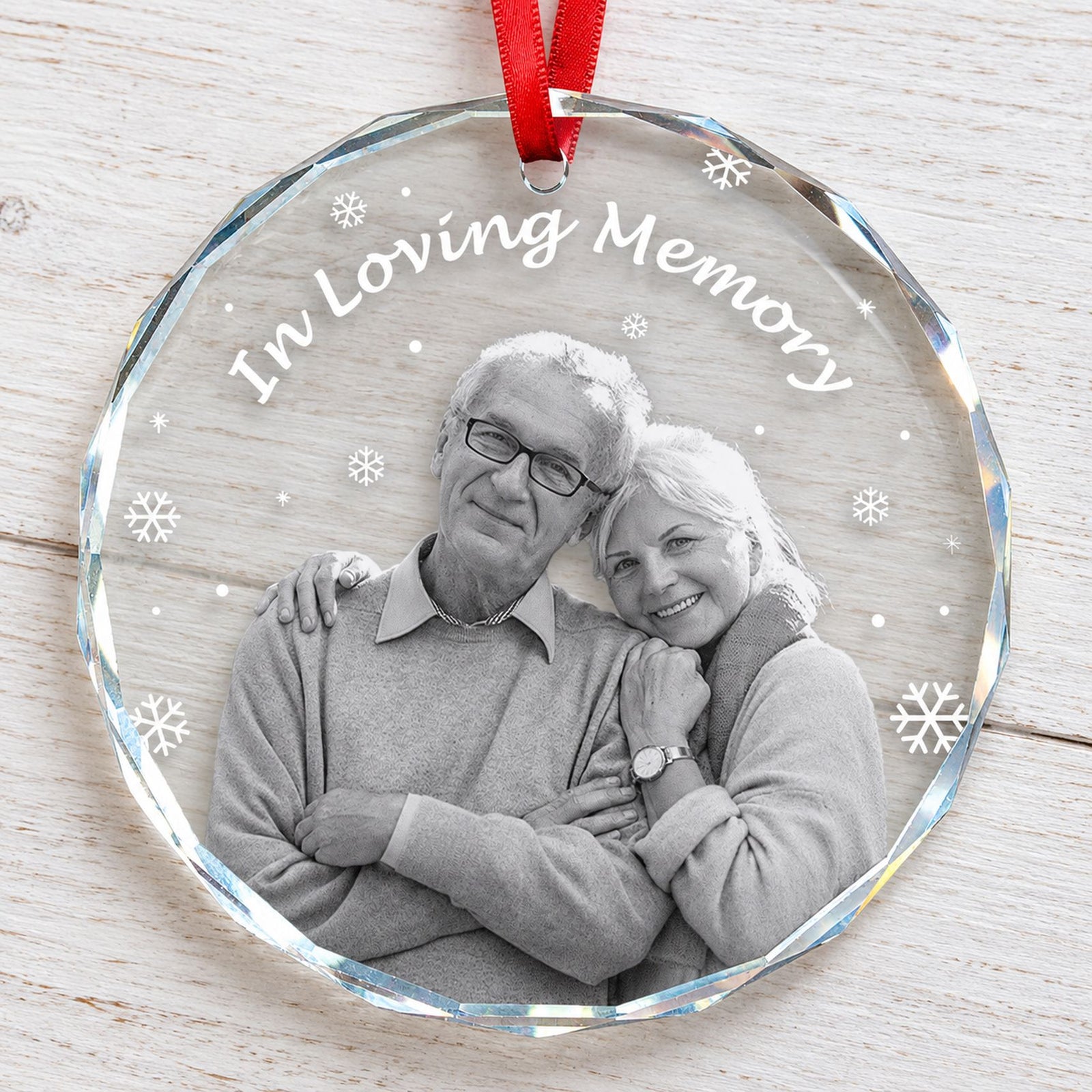 Close-up detail of beveled glass edge and print on memorial Christmas ornament