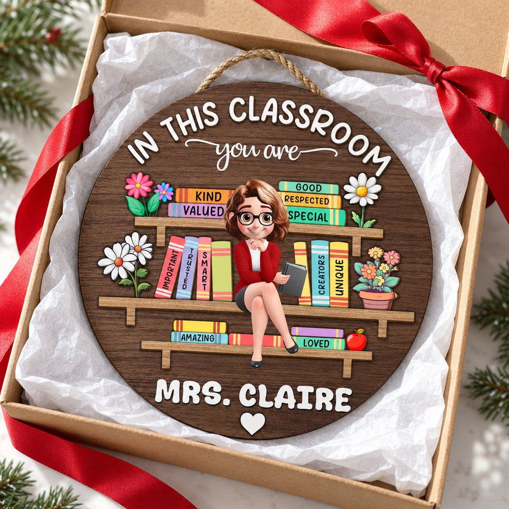 Personalized Mrs. Claire classroom wood sign in a holiday gift box with tissue paper and red ribbon