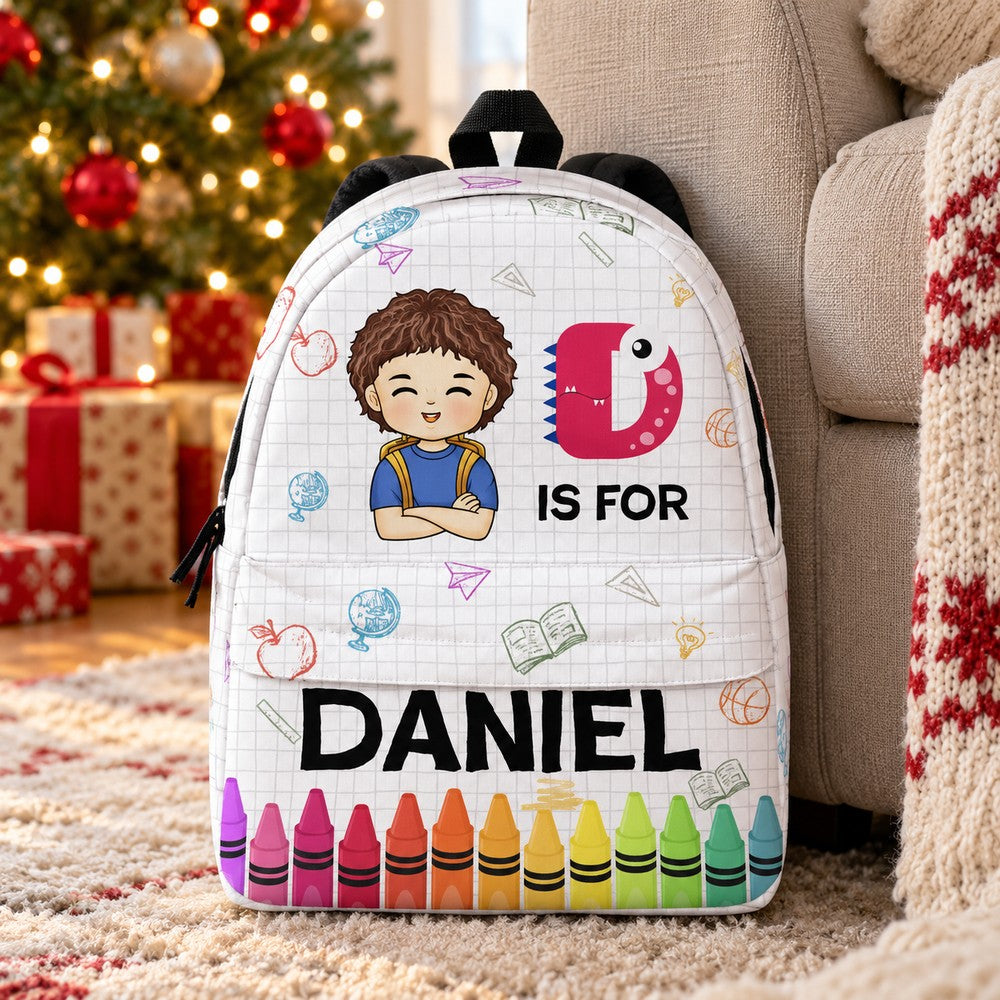 Personalized Daniel kid backpack by a cozy armchair and Christmas tree