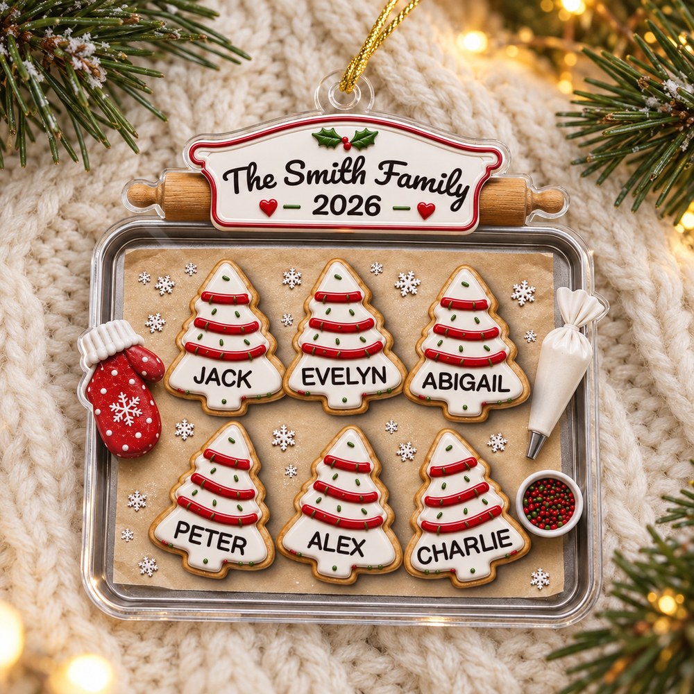 Personalized family baking sheet acrylic ornament lying flat on cozy cream knit fabric with pine needles