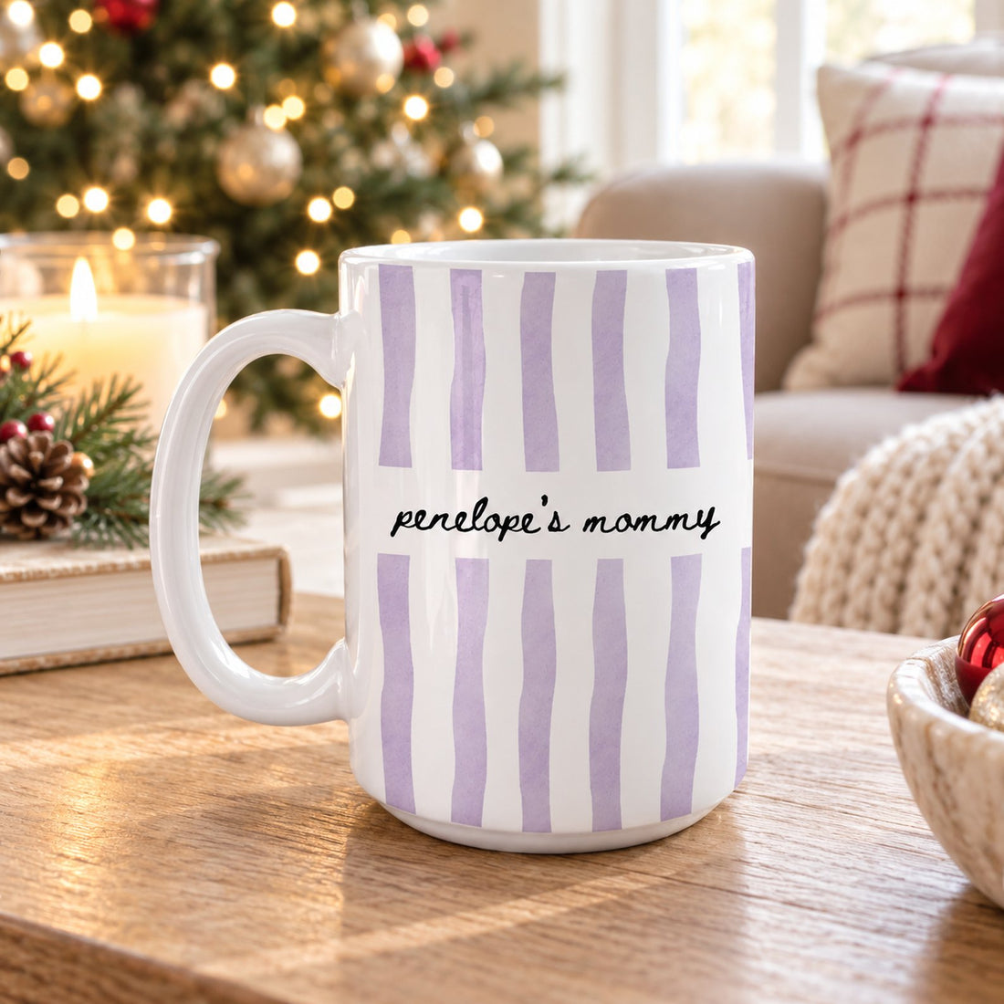 Personalized watercolor stripes mom mug on a wooden table near a Christmas tree