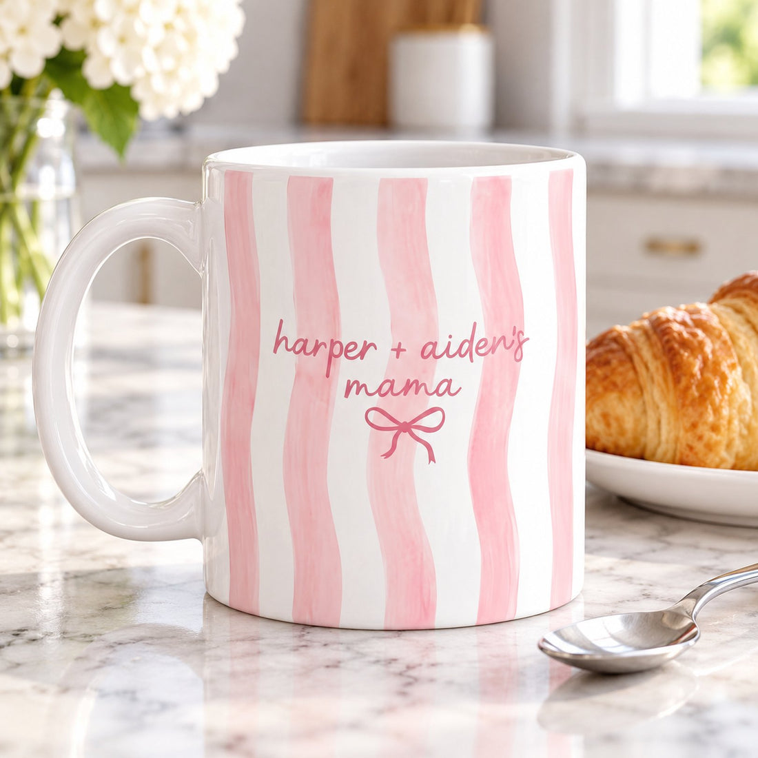 Custom pink striped Mama mug next to a teaspoon and saucer showing real size