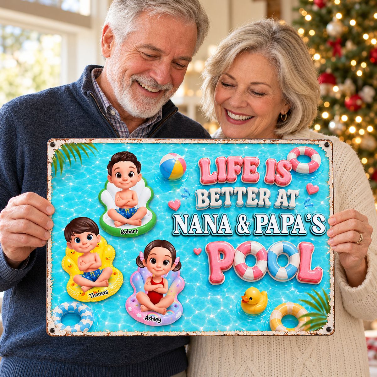 Grandparents holding personalized Nana and Papa pool metal sign on Christmas morning
