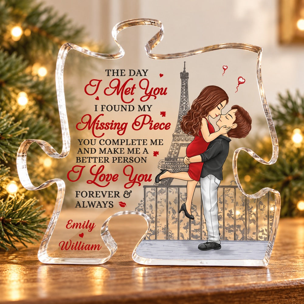 Personalized couple puzzle piece acrylic plaque on a holiday mantel with soft pine greenery and fairy lights