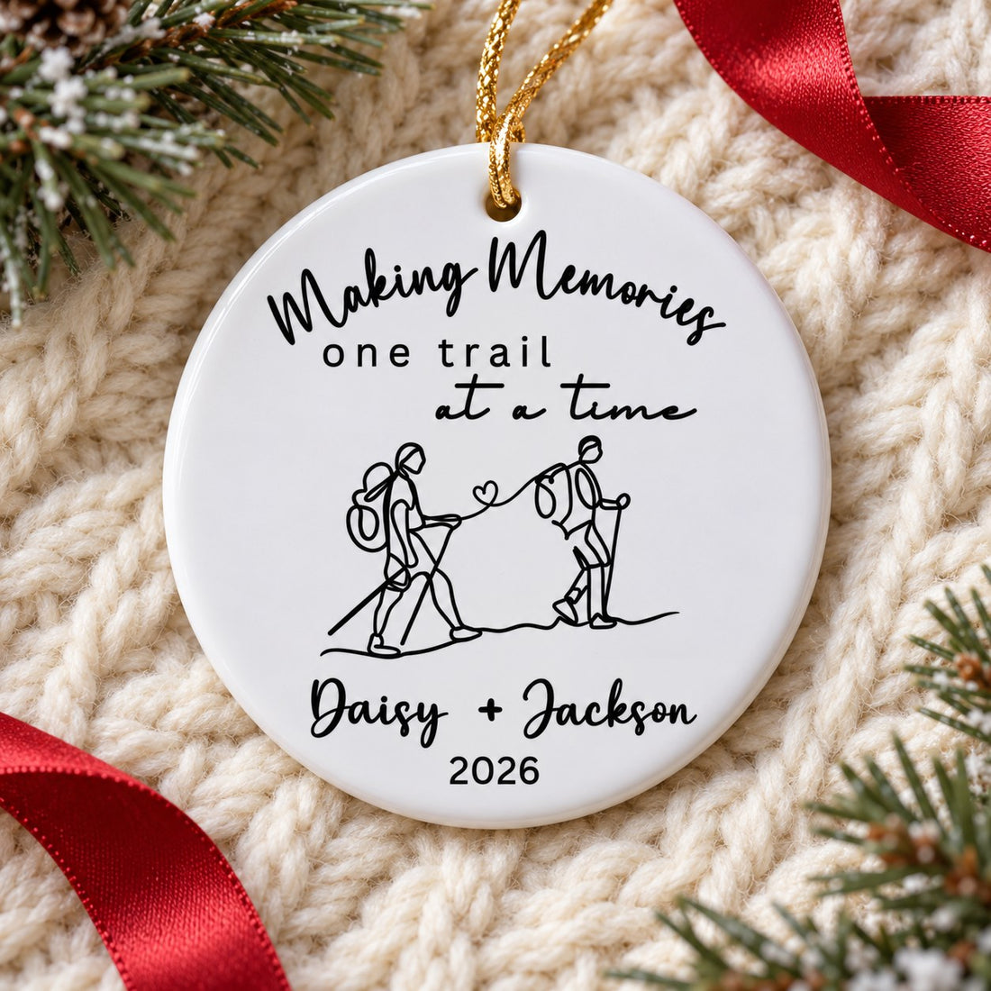 Making Memories One Trail At A Time ceramic ornament lying flat on a cream knit throw