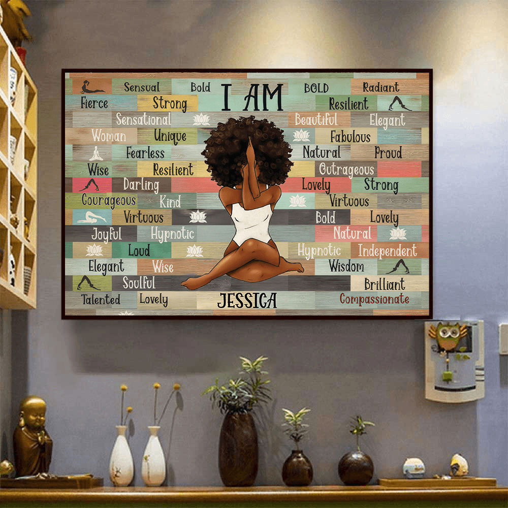 Personalized I Am Black Woman Yoga Pose canvas print, a woman hanging the framed print on a wall