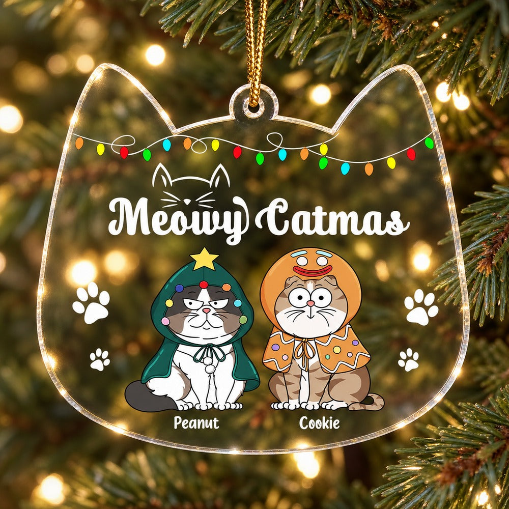 Meowy Catmas personalized cat shaped acrylic ornament hanging on a bright Christmas tree branch