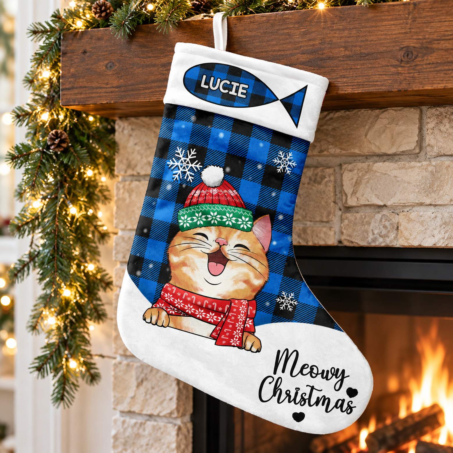 Personalized Meowy Christmas cat stocking LUCIE hanging on a festive fireplace mantel