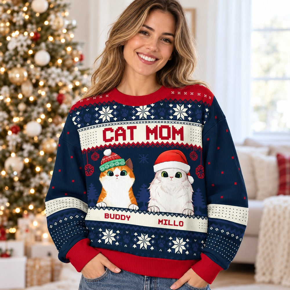 Woman wearing personalized Cat Mom ugly Christmas sweater with Buddy and Millo cats near tree