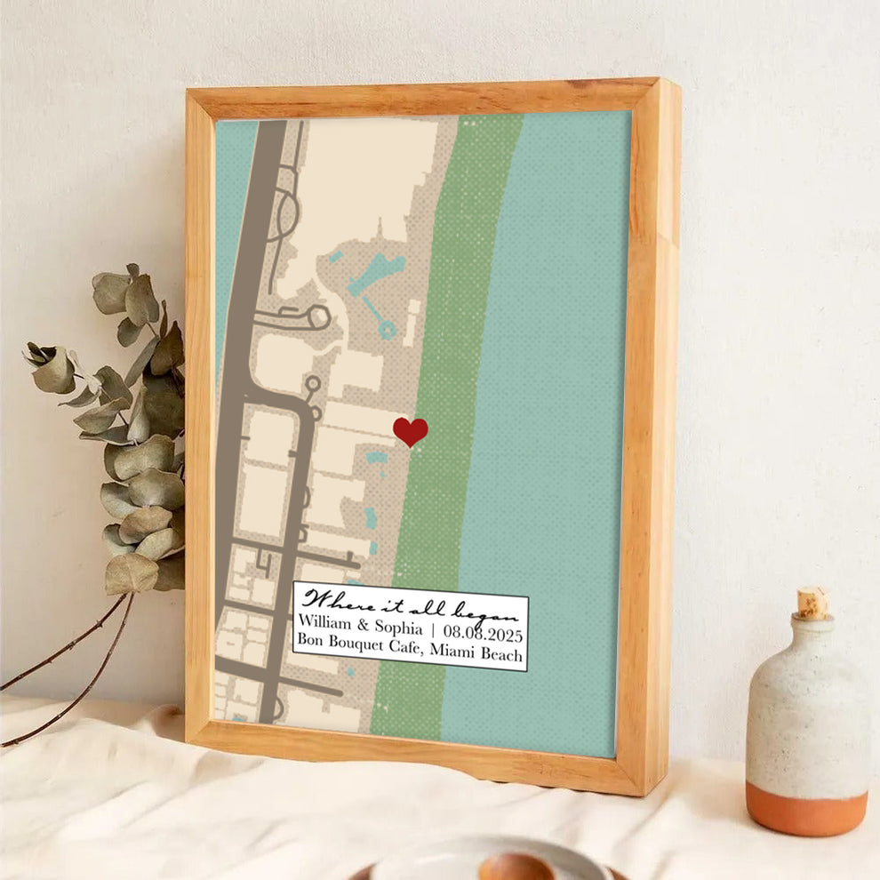 Personalized Where It All Began Where We Met Map Couple poster, leaning against a wall on a wooden floor