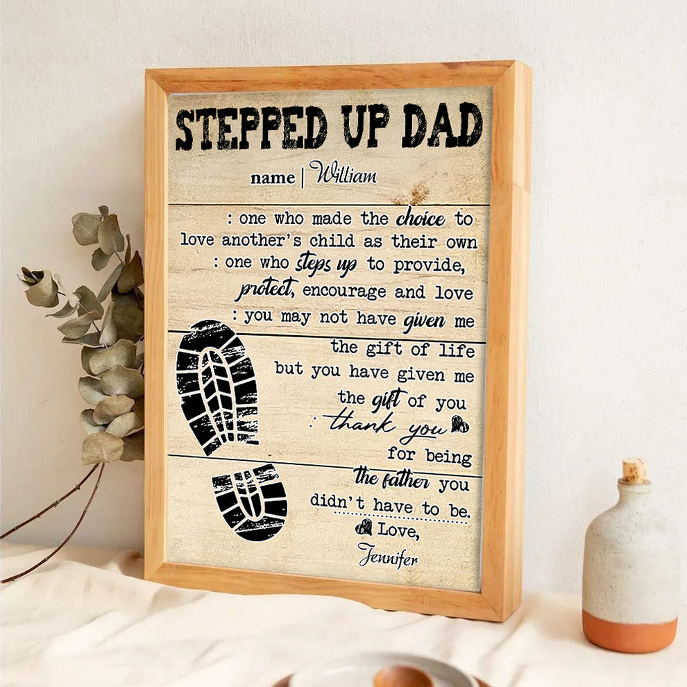 Personalized Stepped Up Dad Happy Father's Day canvas print, leaning against a wall on a wooden floor