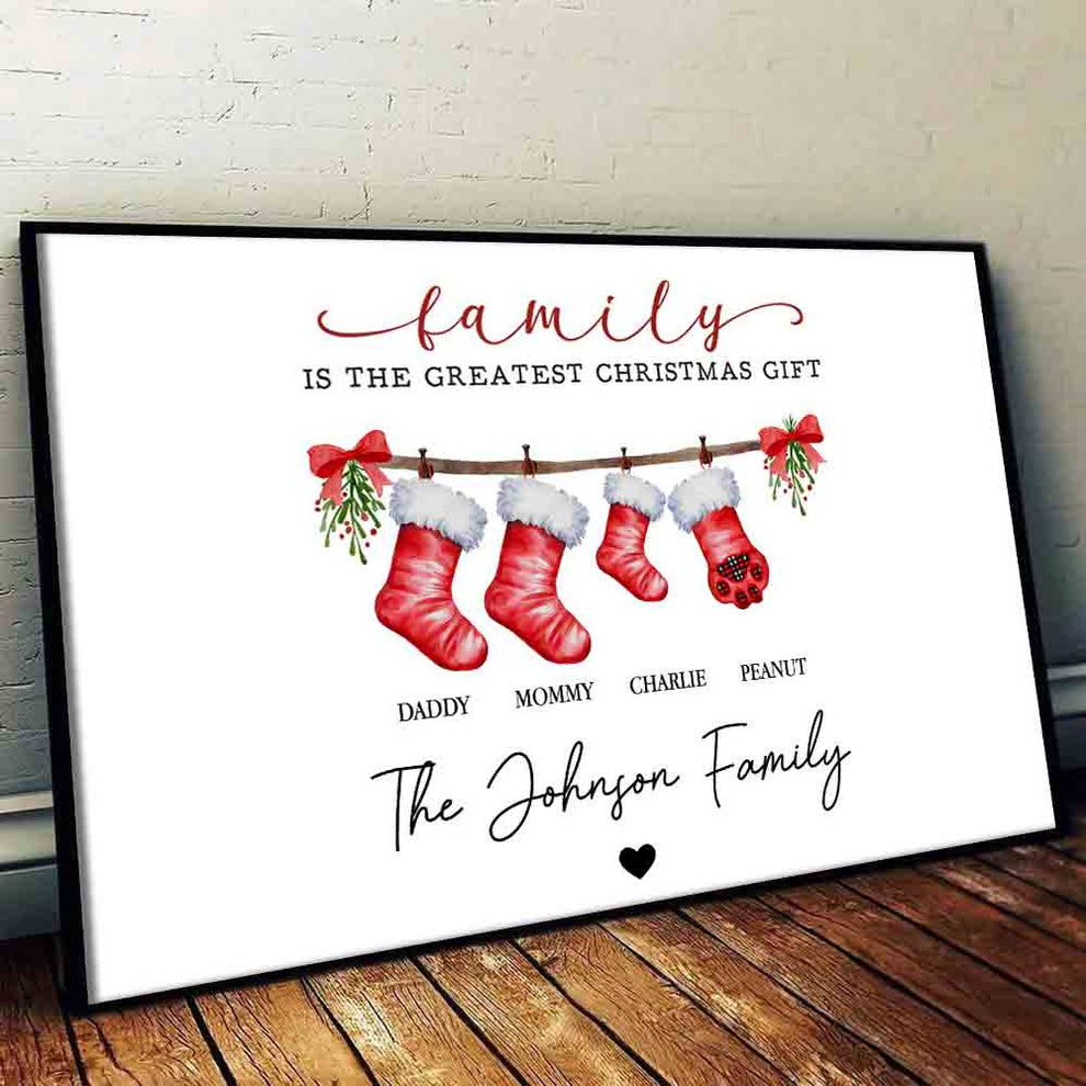 Personalized Family Is The Greatest Christmas Gift canvas print, leaning against a wall on a wooden floor