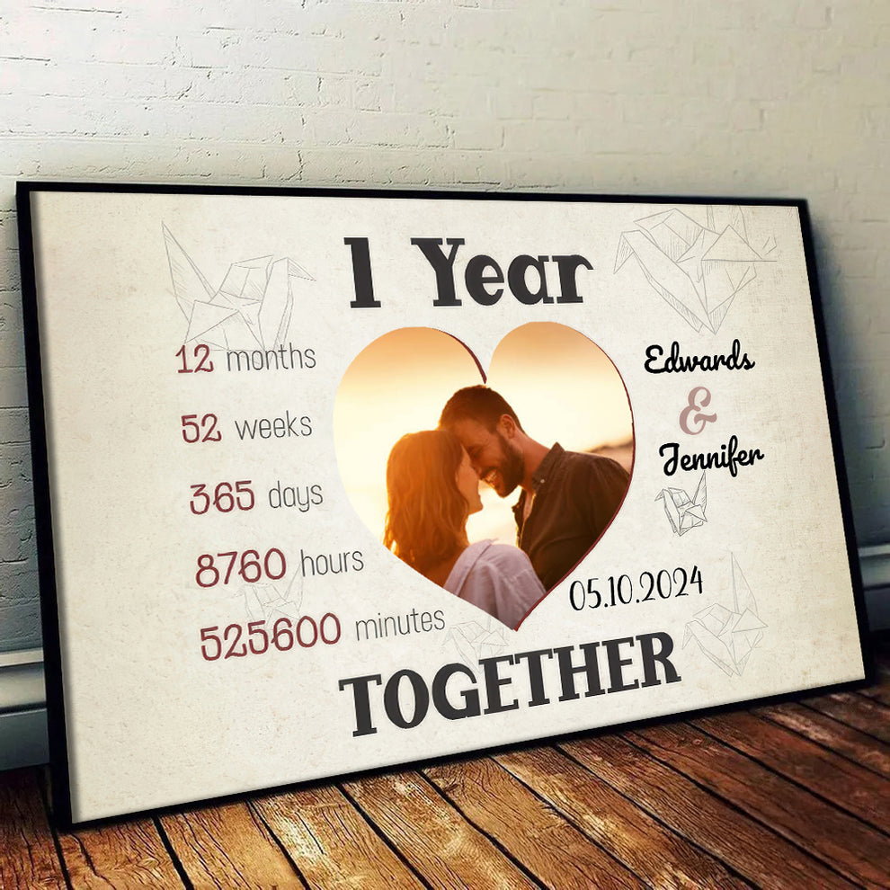 Personalized Custom Photo 1 Year Together Heart-Shaped Couple canvas print, leaning against a wall on a wooden floor