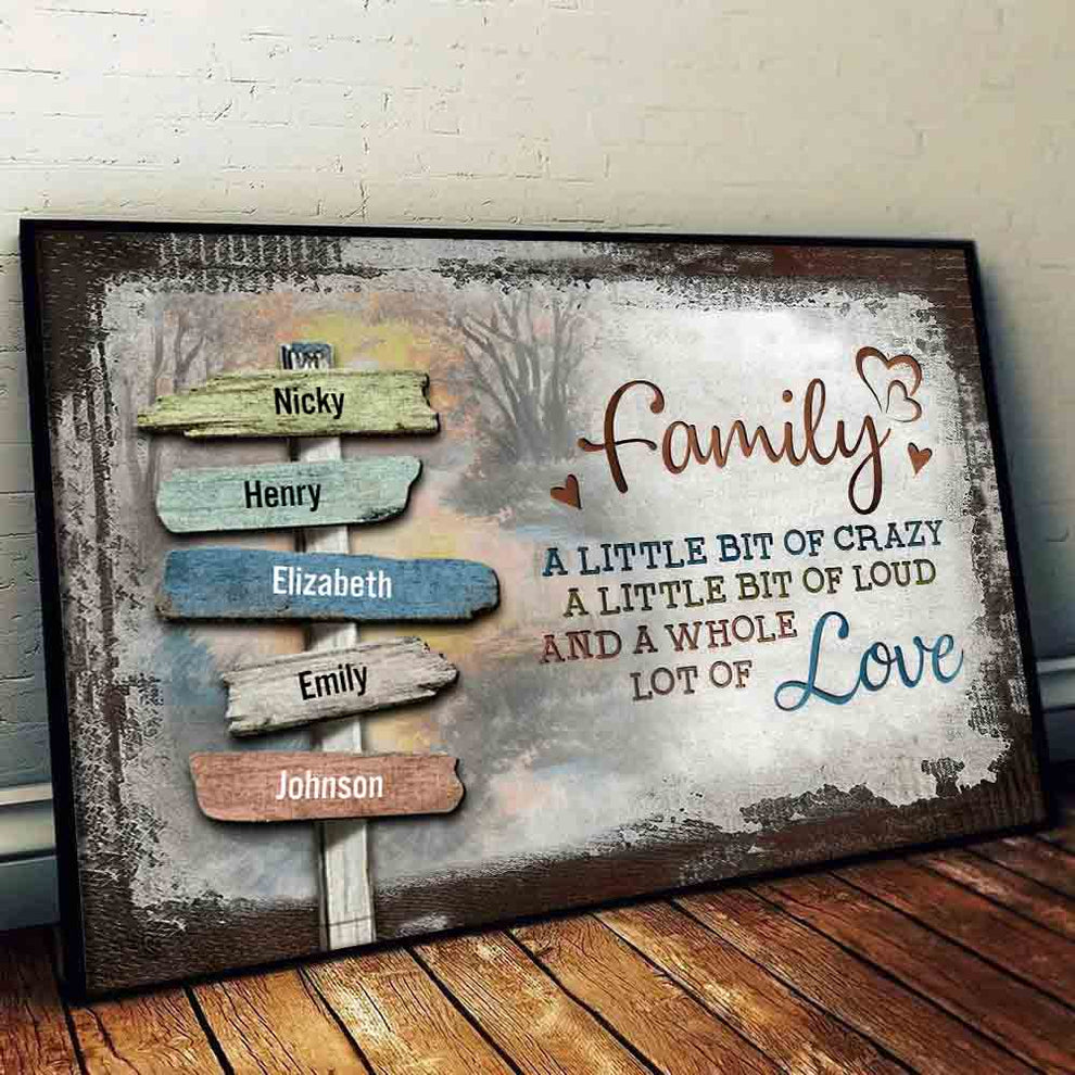Family sign-post canvas "A little bit of crazy, a whole lot of love", leaning against a wall on a wooden floor