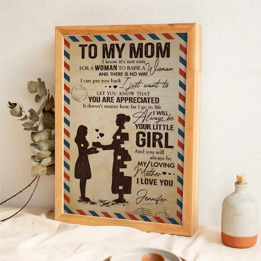 Personalized To My Beloved Mom & Dad poster, leaning against a wall on a wooden floor
