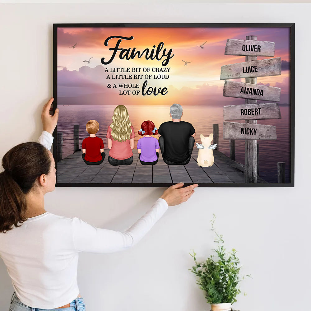 Personalized Retro Vintage Family A Little Whole Lot of Love Sign Posts poster, a woman hanging the framed print on a wall