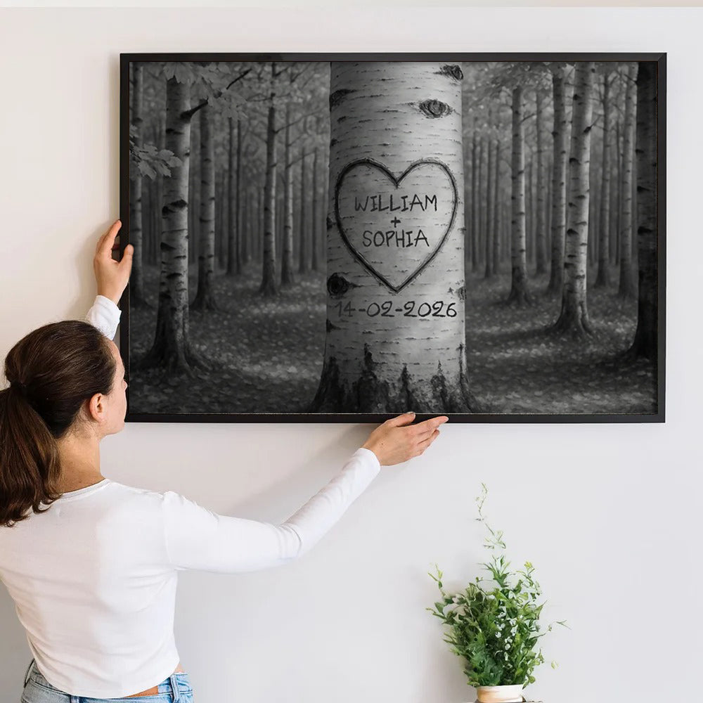 Personalized Couple Names Tree Carving Heart canvas print, a woman hanging the framed print on a wall