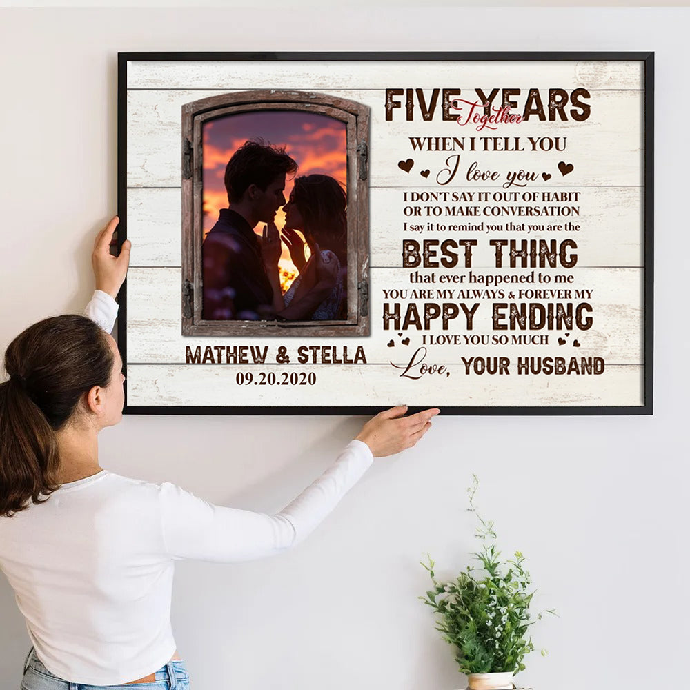 Custom Photo Five Years Together Couple poster, a woman hanging the framed print on a wall