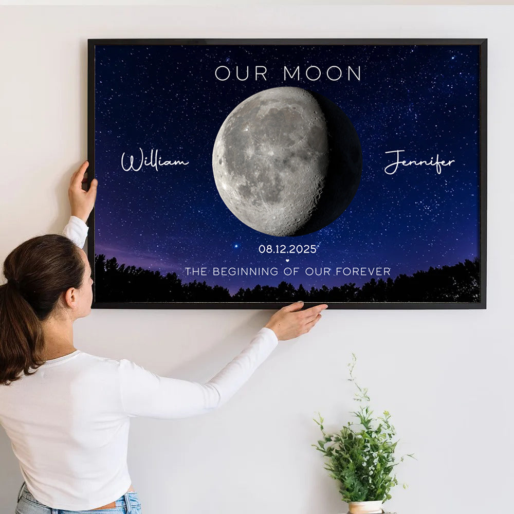 Personalized Couple's Anniversary Moon Phase Canvas print, a woman hanging the framed print on a wall