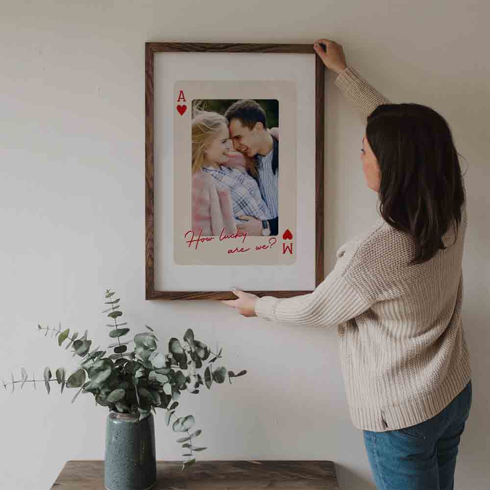 Custom Photo Couple King And Queen How Luck We Are poster, a woman hanging the framed print on a wall