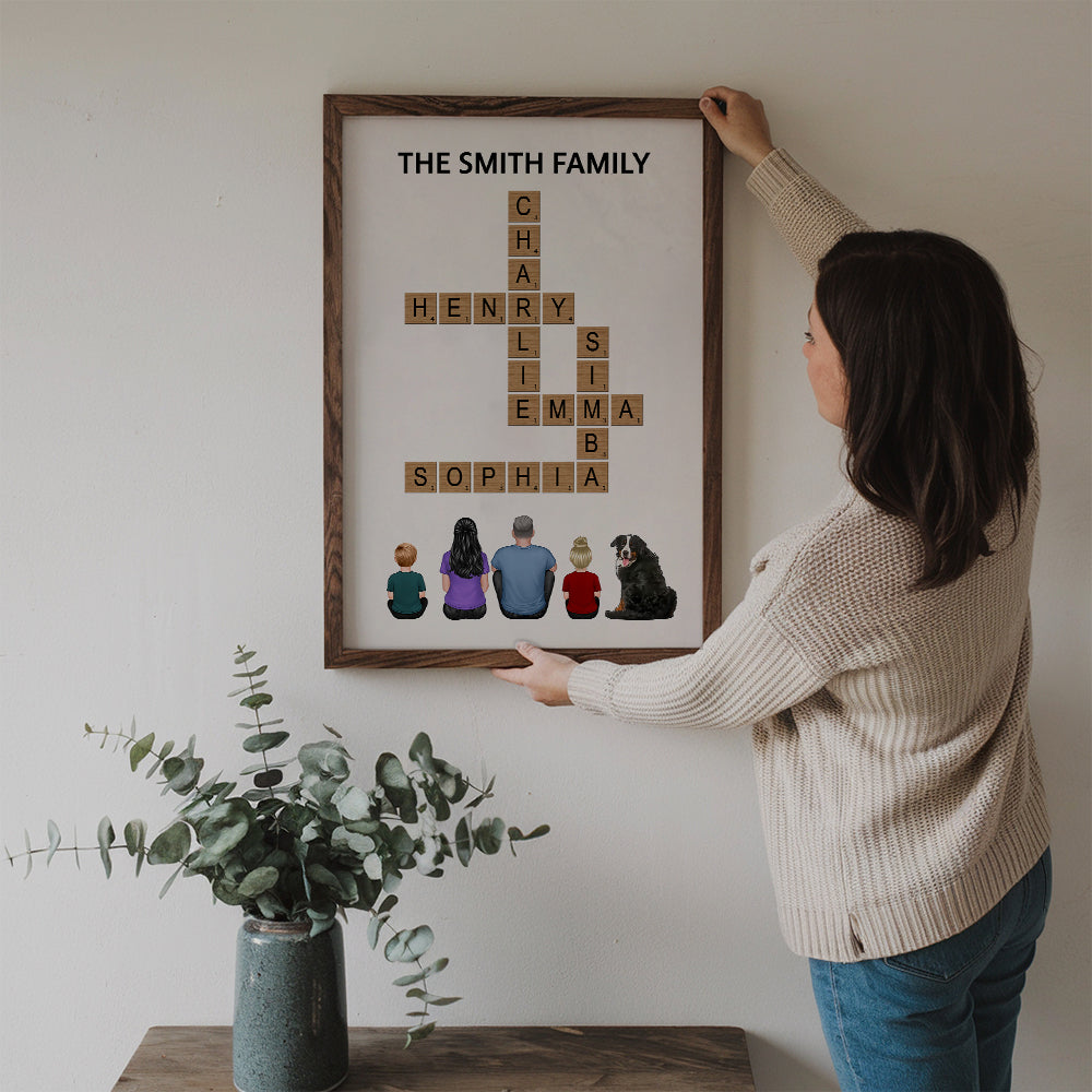 Personalized Family Make Your Own Crossword poster, a woman hanging the framed print on a wall