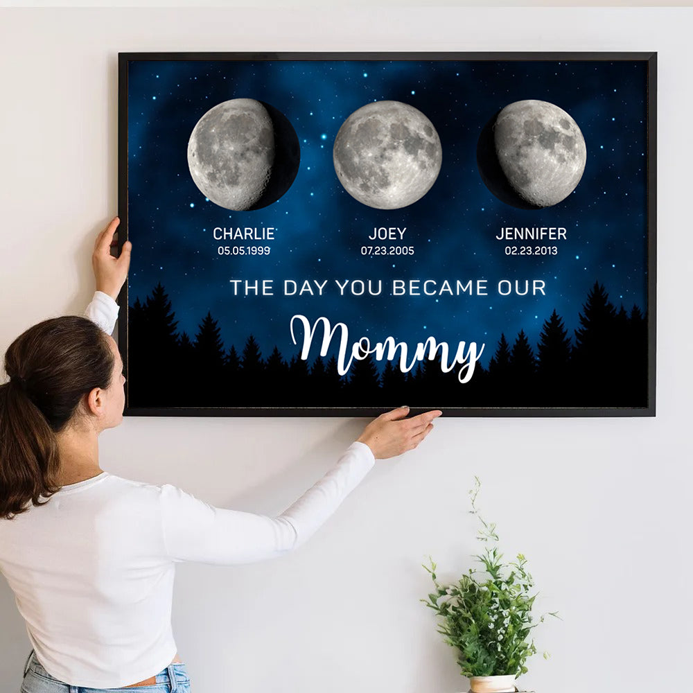 Personalized The Moon Glowed Brighter The Day You Became Mom poster, a woman hanging the framed print on a wall