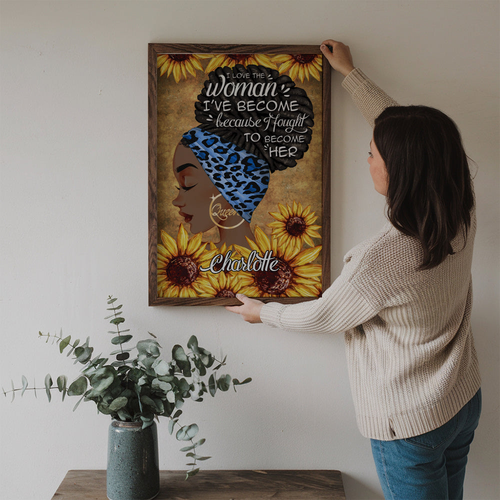 Personalized I Am The Storm poster, a woman hanging the framed print on a wall