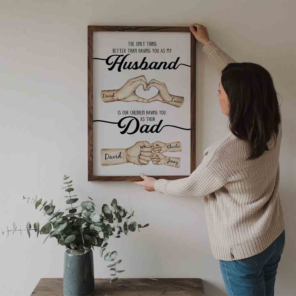 Personalized The Only Thing Better Husband Dad Hands poster, a woman hanging the framed print on a wall