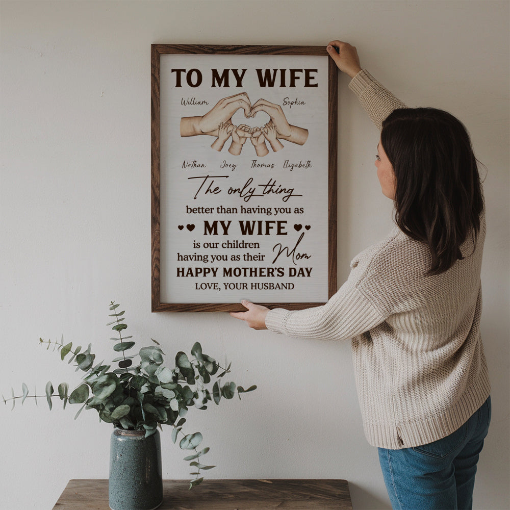 Personalized The Only Thing Better Than Having You As My Wife poster, a woman hanging the framed print on a wall