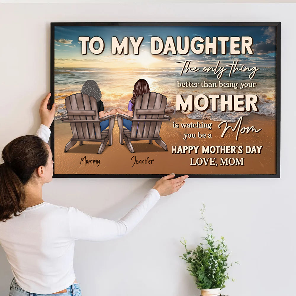 Personalized Beach Landscape To My Daughter From Mom poster, a woman hanging the framed print on a wall
