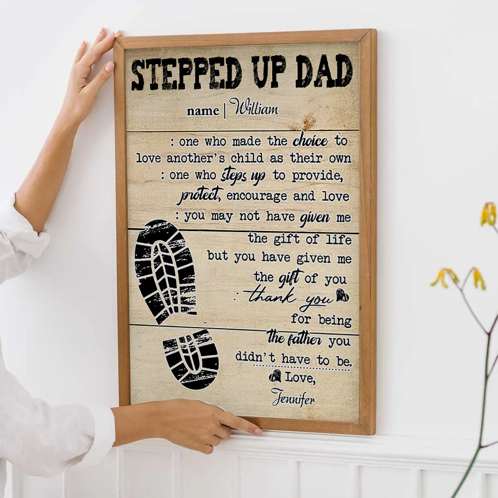 Personalized Stepped Up Dad Happy Father's Day canvas print, framed in a bright living room