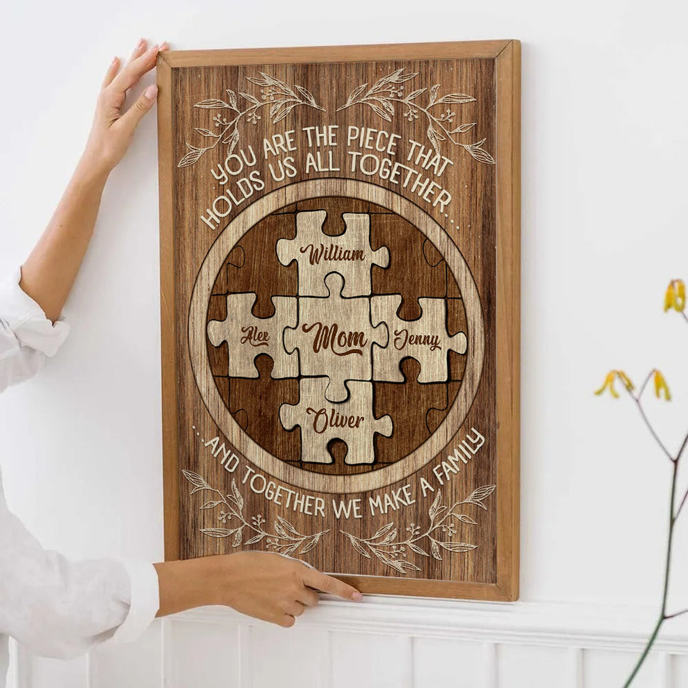 Mom's Custom Puzzle Canvas Print: "You Are The Piece That Holds Us poster, leaning against a wall on a wooden floor